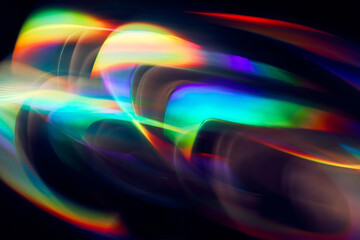 Blurred Light painting one exposure in camera. light glares with a spectral gradient on a dark...