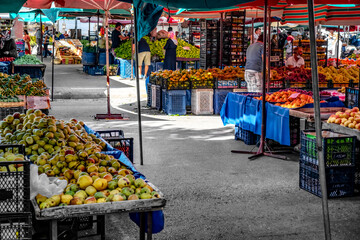 Alanya, Turkey - October 23, 2020: Vegetable and fruit stalls in Alanya street food market. Tables...