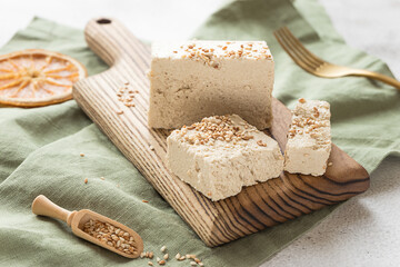 Sliced tahini halva on a wooden board