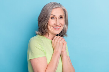 Photo of charming happy cheerful old woman good mood smile isolated on pastel blue color background