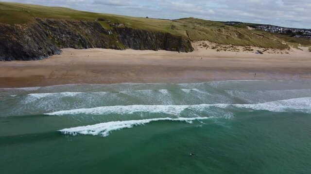 Holywell bay coastline cornwall england uk aerial drone 
