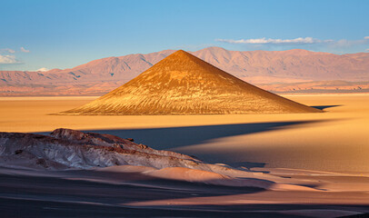 The volcanic cinder cone Cono de Arita on the salt flat Salar de Arizaro in northwest Argentina. 