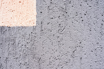 gray with pink brush marks painted cement walls