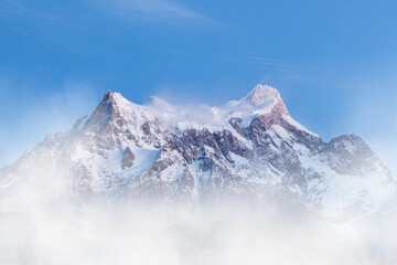 Obraz premium The snow and glacier covered summit of Cerro Paine Grande in Torres del Paine National Park, Patagonia, South Chile