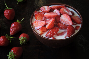 Strawberries with cream bowl. Summer dessert.