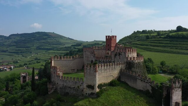 Aerial view, point of interest on Soave castle, province of Verona, Italy. Italian historic castles. The famous medieval castle on the hill. Aerial panorama of the castles of Italy.