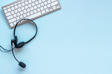 Headset on computer laptop. Equipment for pc call center support