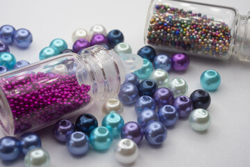 beads and bottles on a white background
