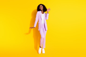 Full size photo of young beautiful stunning smiling afro businesswoman look copyspace isolated on yellow color background