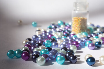 beads and bottle on a white background