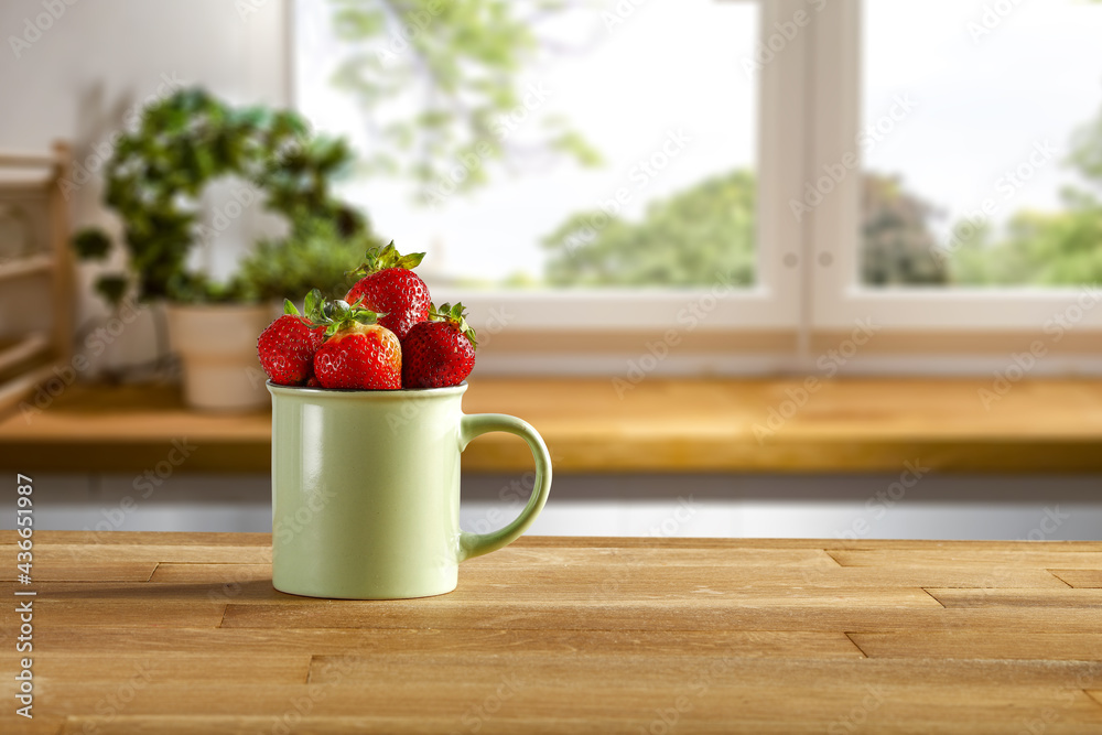 Sticker fresh red fruits on desk in kitchen interior and free space for your decoration