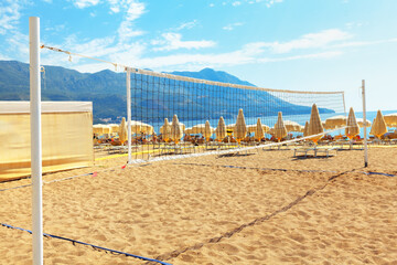 Beach volleyball playing field . Tourist resort and sandy beach in Becici Montenegro . Adriatic Sea Coast in the summertime