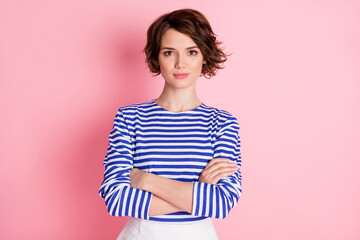 Photo of girl folded hands confident look camera wear striped shirt isolated pastel pink color background