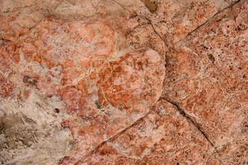 Bright colorful of natural stone with cracks on the surface.