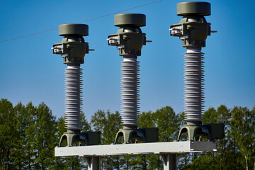 Installation of new insulators and conductors for a high-voltage line across the countryside near...