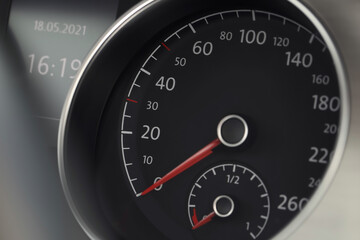 Speedometer on modern car dashboard, closeup view