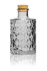 Empty bottle of crystal glass, sealed with a cork. Isolated on a white background with reflection