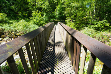 Metal bridge over a small river in Ticino