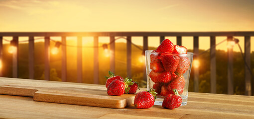 Fresh red straberries on wooden table and free space for your decoration. 