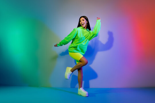 Full Length Body Size View Of Lovely Carefree Cheery Girl Dancing Chill Out Resting Night Isolated Over Multicolor Vivid Neon Light Background