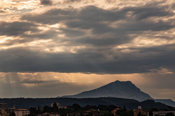Obraz na płótnie Canvas the Sainte Victoire mountain, in the light of spring in stormy weather