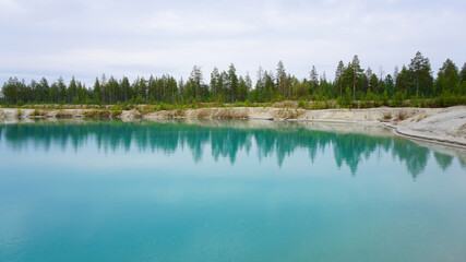 nature landscape summer spring blue clear lake forest in the distance