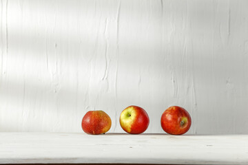 Fresh red apples fruits on desk and free space for your decoration 