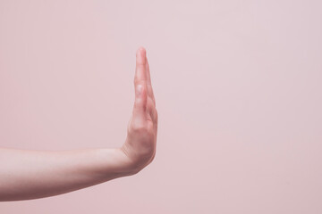 hand of a person showing stop gesture