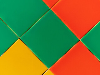 Colorful mosaic tile texture. Bright abstract tropical summer yellow green orange ceramic tiles background outside exterior architecture detail. Multicolored house facade geometrical surface wallpaper