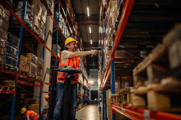 Warehouse worker working with bar-code scanner