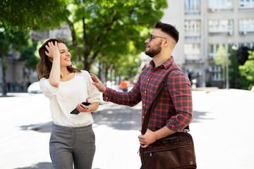 Happy young couple outdoors. Loving couple walking in the city.