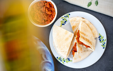Red paste of dried tomatoes and peppers with pita - Mediterranean breakfast 