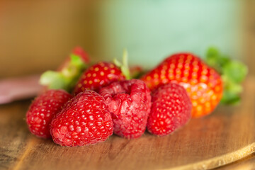 close up of raspberries and strawberries in a kitchen