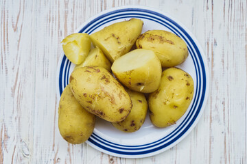 Plate with freshly boiled potatoes. Healthy food backgrounds