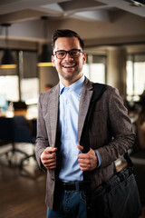 Fototapeta premium Portrait of handsome businessman. Young man working in the office.