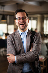 Portrait of handsome businessman. Young man working in the office.