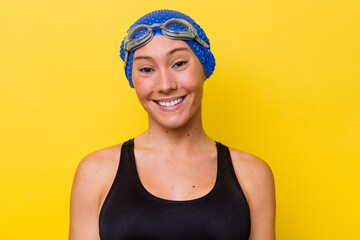 Young australian swimmer woman isolated on yellow background