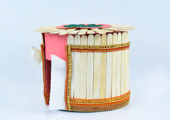 A nice tissue box made with some small wooden ice cream sticks stacked together