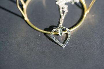 Heart pendant necklace symbol of love Romance Valentine's Day Closeup shoot in a summer day. Selective Focus. High quality photo