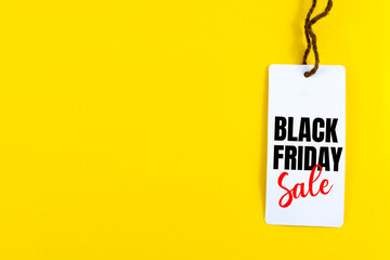 Black Friday. Sale tag on the yellow background