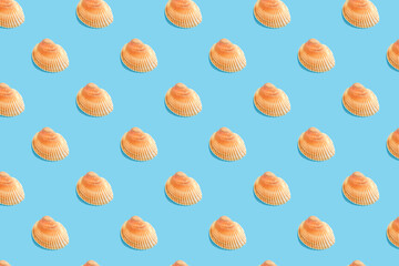 Colorful pattern seashells on a blue background. Summer pattern.