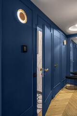 Blue classic wall decor in modern interior with golden line decor elements, wooden floor, hidden doors