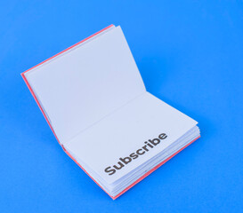 Book made with small craft paper and nicely placed on a paper background