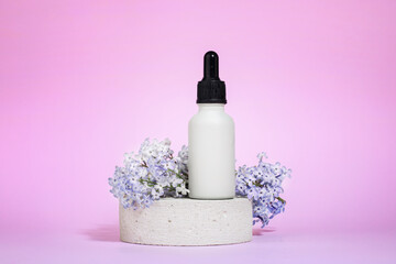 Obraz na płótnie Canvas Mock up glass dropper bottle on a concrete gray podium against a pink background with hard shadows and lilac flowers. Hard shadows. Cosmetic pipette on a white background.