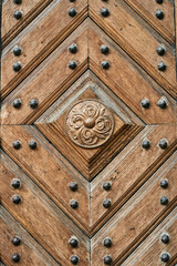 wooden door with metal rivets