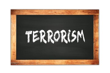 Fototapeta premium TERRORISM text written on wooden frame school blackboard.