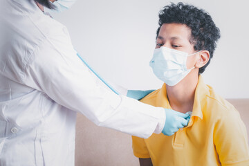 Medical health care, Woman doctor check body young boy by stethoscope wearing face mask for protection virus, Medical concept woman doctor examining patient with a stethoscope concept,