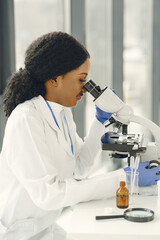 Female Scientist Working in The Laboratory Using a Microscope