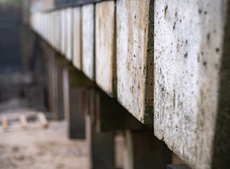 Close and selective focus on the concrete blocks of a public slipway. Intentional shallow depth of field and bokeh