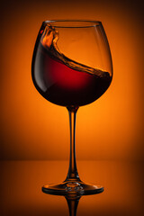 Still life, glass glasses with wine, on a background with a spot, and with a reflection